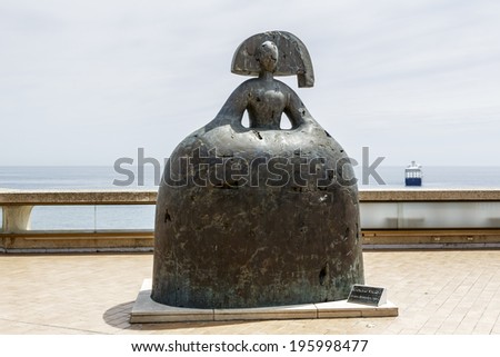 MONTE CARLO, MONACO - MAY 12, 2014: Reine Mariana sculpture, made in 2004 by Manolo Valdes, well-known Spanish artist residing in New York, located near Opera de Monte-Carlo at the coast front