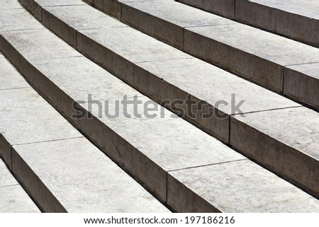 Granite stairs with traces of wear are shown up close