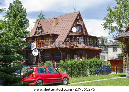 ZAKOPANE, POLAND - JULY 13, 2014: Villa W Sloncu, wooden house built of wood around year 1930, offers 4 guestrooms
