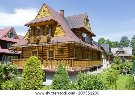 ZAKOPANE, POLAND - JULY 13, 2014: Residential building, wooden villa built in the style of the regional architecture in the first quarter of the 20th century