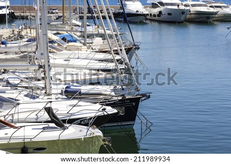 SAINT JEAN, FRANCE - MAY 23, 2014: Moored yachts in port at Saint Jean Cap Ferrat, famous one of the most beautiful tourist destinations and one of the most expensive residential location in the world