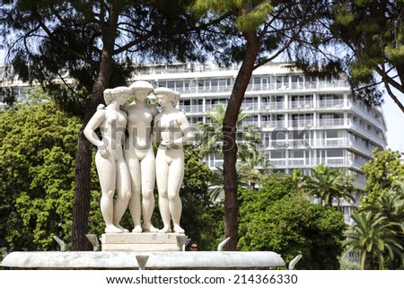 NICE, FRANCE - MAY 21, 2014: Fountain of The Three Graces, called Charities in Greek mythology, La fontaine des Trois Graces, Fountain is located at the Jardin Albert 1er, was inaugurated in 1960