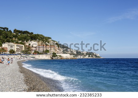 NICE, FRANCE - MAY 18, 2014: Castle Hill, the hill on which there are only remains of the castle, Castle beach below, the first of approx. 30 beaches spread over 7 km long coastline in the City