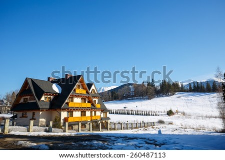 ZAKOPANE, POLAND - MARCH 09, 2015: Villa named Wisienka located in an attractive place nearby the downtown in a large open space with beautiful views of the Tatras, offers 15 well equipped guest rooms