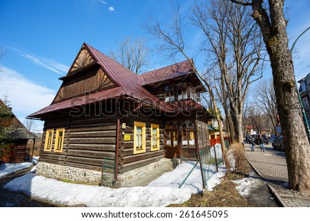 ZAKOPANE, POLAND - MARCH 10, 2015: Residential building, wooden villa built in  approx. 1897 in the style of the regional architecture, listed in the municipal register of architectural heritage