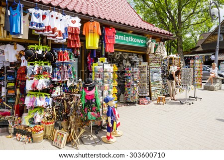 ZAKOPANE, POLAND - JUNE 07, 2015: Various souvenirs offered for sale, the stands located along the famous pedestrian street, among other offers stylized gifts and many small stuff