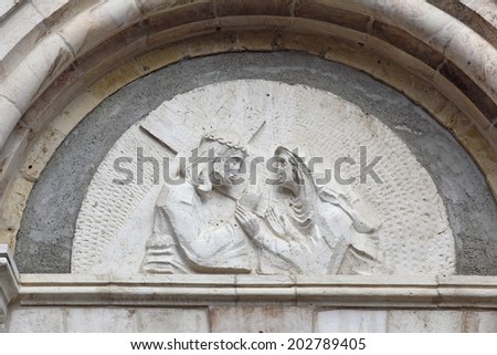 Jerusalem, Israel: October 17, 2012 - Sculpture depicting Mary Magdalene and Jesus carries the Cross, Jerusalem, Israel