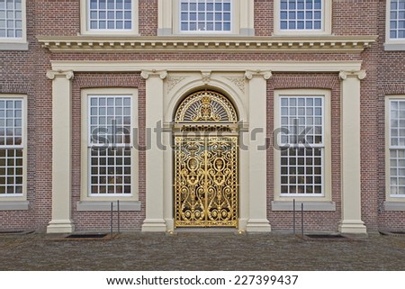 Apeldoorn, Netherlands - October 31, 2014: golden doors at the rear of Palace Het Loo in Apeldoorn.