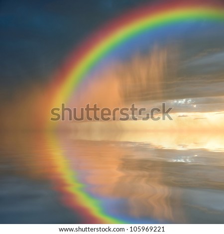Colorful rainbow over water, thunderstorm with rain on background