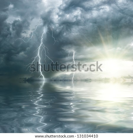 Thunderstorm with rain and lightning over ocean, the sun shines through clouds