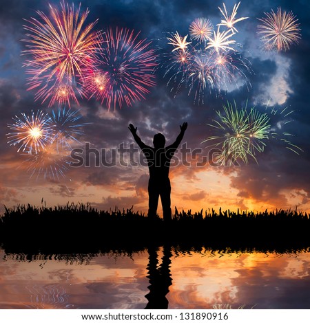 A Man Standing With Open Arms, Looks Beautiful Holiday Fireworks, Feeling Of Freedom