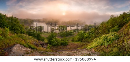 Morning landscape rising above the river mist sun