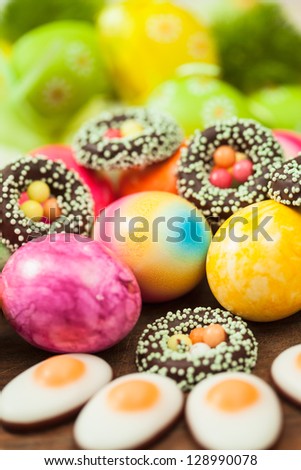 Close up of colorful easter eggs and sweets