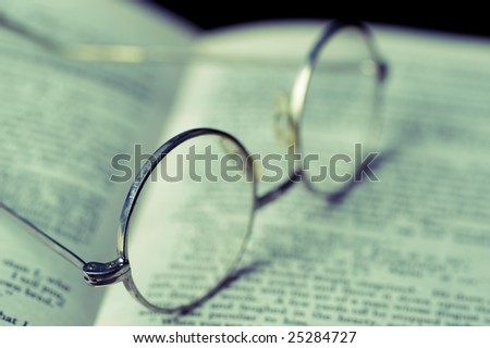 Glasses on opened book. Educational and learning concept
