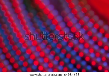 Red and blue abstract dots. Image is blurry