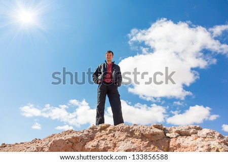 Man standing on top of mountain. Conceptual design