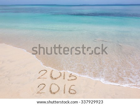 New Year 2016 is coming concept. Happy New Year 2016 replace 2015 concept on the sea beach