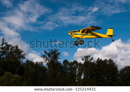 A great front page cover of a bush plane coming in for a landing./Bush Plane Landing
