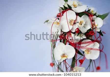 bouquet of orchid and wedding dress
