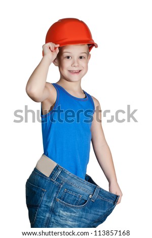 little boy with hard hat and in too big jeans
