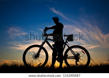 cyclist with a bike silhouette on a blue sky background