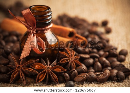 Bottle coffee aroma oil with coffee beans. aromatherapy