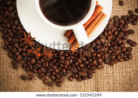 cup of aromatic coffee with cinnamon and anise star. still life