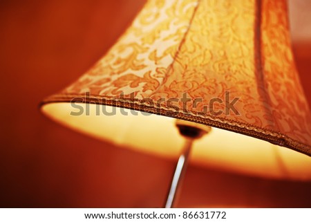Floor lamp with shadow in hotel room