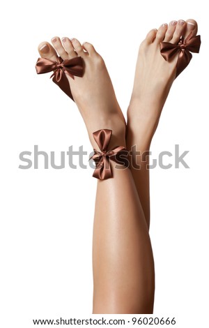 Legs with a bow on white background