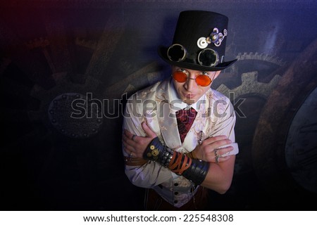 Portrait of a steam punk man over grunge background with hours