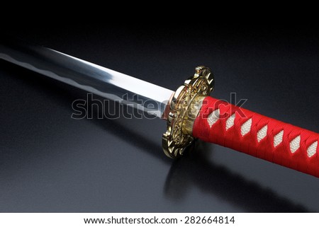 Japanese samurai sword against a dark background