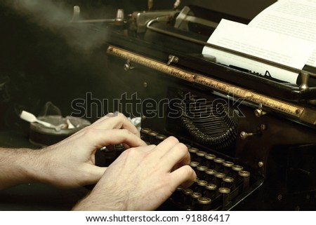 The image of the writer or the reporter behind the typewriter in retrostyle with a cigaret smoke
