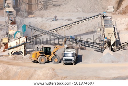 processing plant stones and excavator loading dumper truck