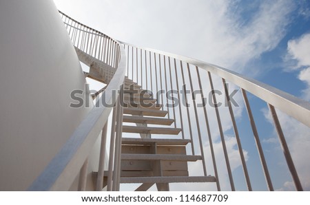 White storage tank with stairs.