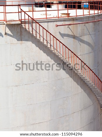 White storage tank with stairs.