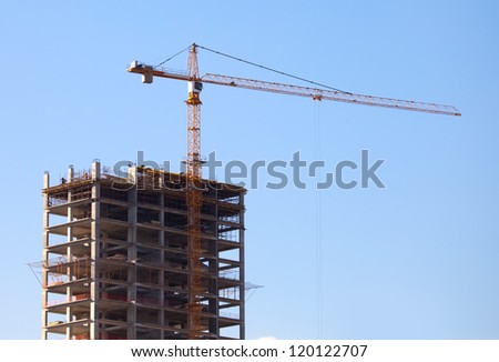crane on top of building and construction site