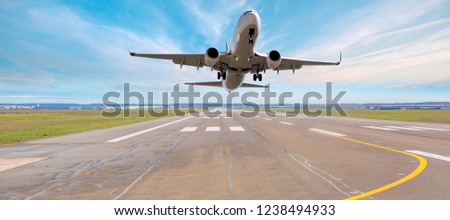 Airplane taking off from the airport at sunset - Travel by air transport