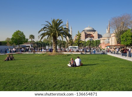 ISTANBUL, TURKEY - APRIL 27 : Tourists near Hagia Sophia on April 27, 2013 in Istanbul, Turkey. Hagia Sophia is a former Orthodox basilica, later a mosque, and now a museum.