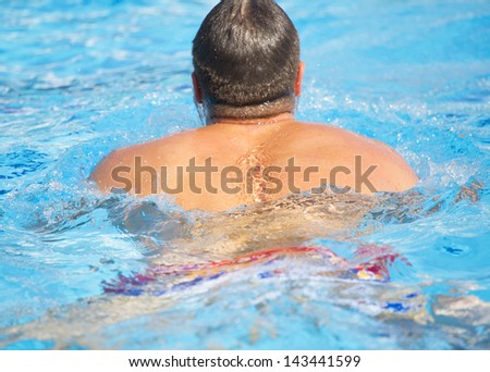 Man swimmer in swimming pool