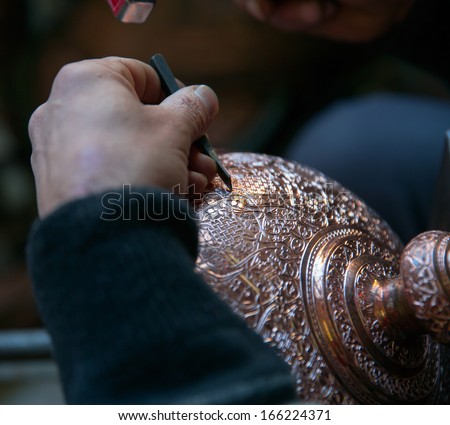 Copper master, Hands detail of craftsman at work