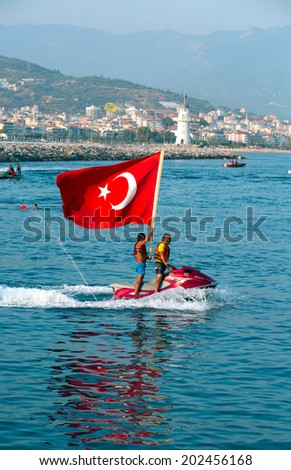 ALANYA, TURKEY - JULY 01:  Jet ski men showed in the coast in Alanya beach for Feast of cabotage on july 01, 2014 in Alanya Turkey.