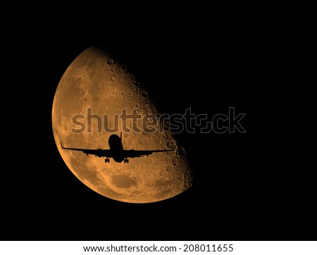 an airplane flying across moon .\