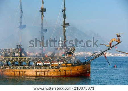 ALANYA -TURKEY - JULY 01: Pirate ship showed in the coast in Alanya beach for Feast of cabotage on july 01, 2014 in Alanya Turkey. 01 July 2014. Ship traveling around Alanya castle