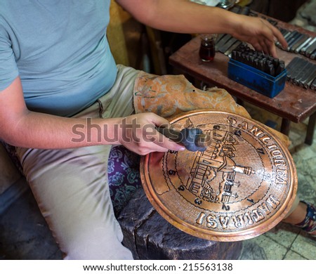 Copper master, Hands detail of craftsman at work