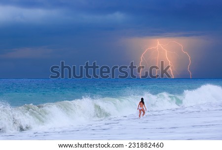 girl looking at the lightning in the sky