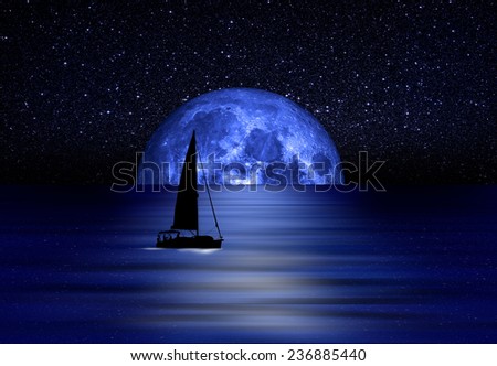 Sailing yacht illuminated by the light of a full blue moon 
