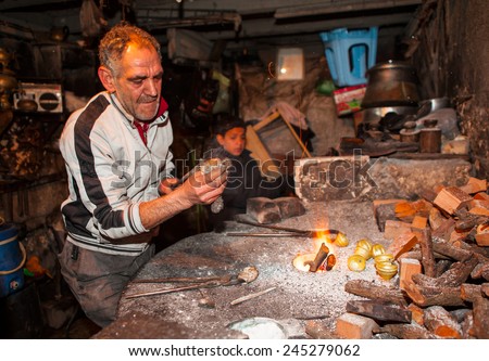 URFA - TURKEY - DECEMBER 10:Copper master, Hands detail of craftsman at work on December 10 2011 in Urfa Turkey.