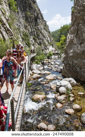SAPADERE - TURKEY - MAY 31: Tourists walk in a canyon at may 31, 2014 in Sapadere, Turkey. Sapadere Canyon is located in Antalya
