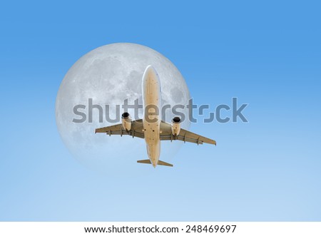 Passenger airplane on the blue sky background against White moon \
