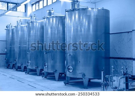 Contemporary large steel barrels in winery, food industry